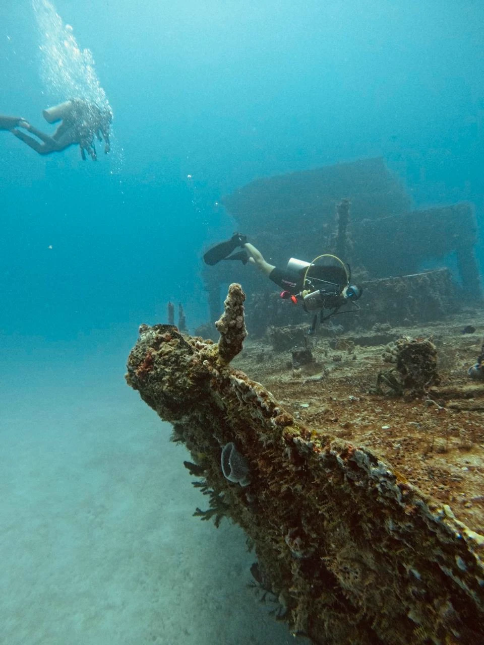 Diver exploring wreck deck in Puerto Morelos