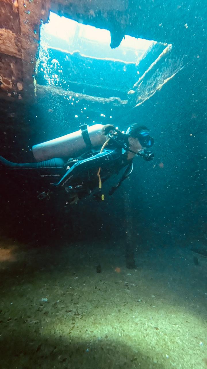 Diver inside wreck in Cozumel